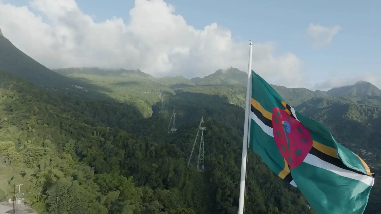 The Dominica flag flies above the cableway alignment
